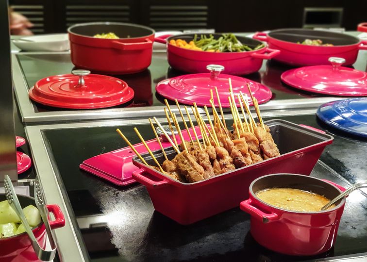 Chicken satay with condiments at the British Airways Singapore Lounge